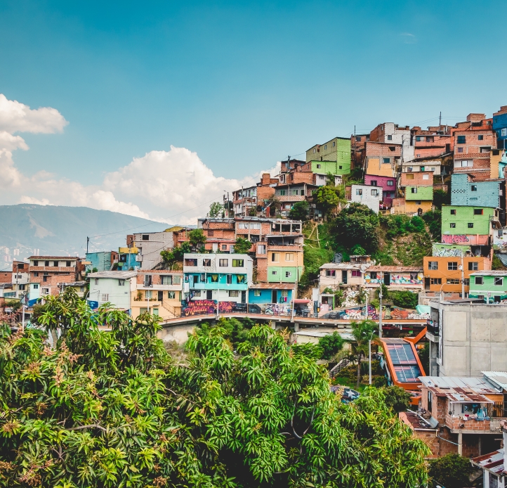panoramic view of Medellin, Colombia with houses on the hillside and beautiful sky