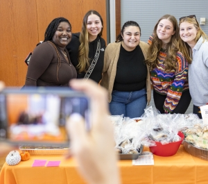 students at a bake sale table